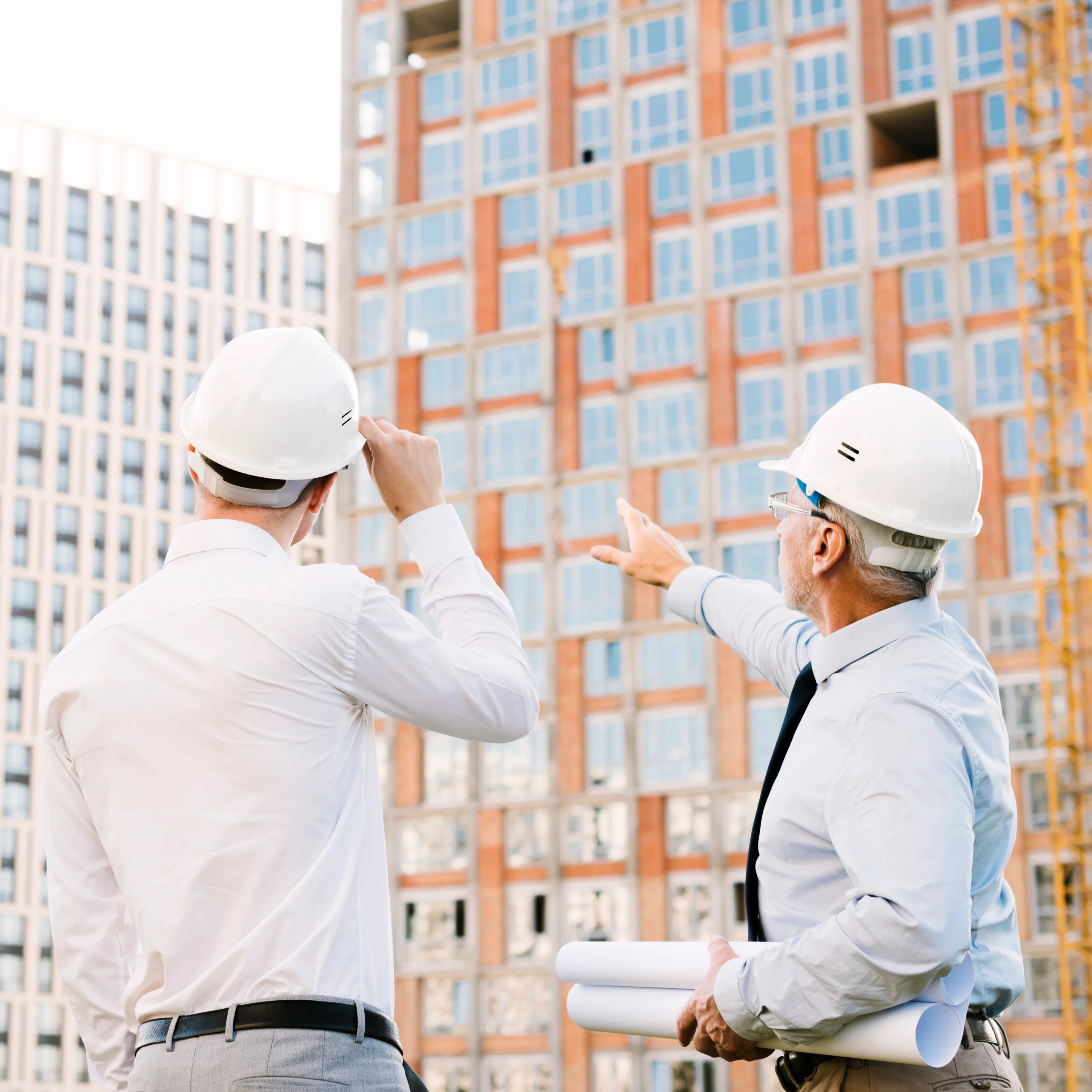 Site manager reviewing a development, construction tax